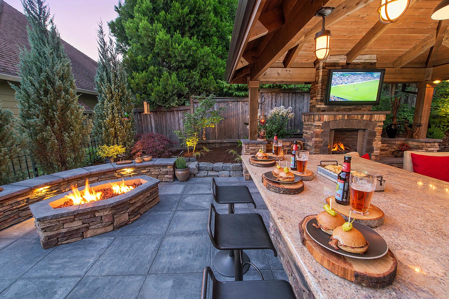 OutDoor Kitchen with a Custom BBQ Fire pit.