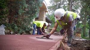 Construction workers install concrete