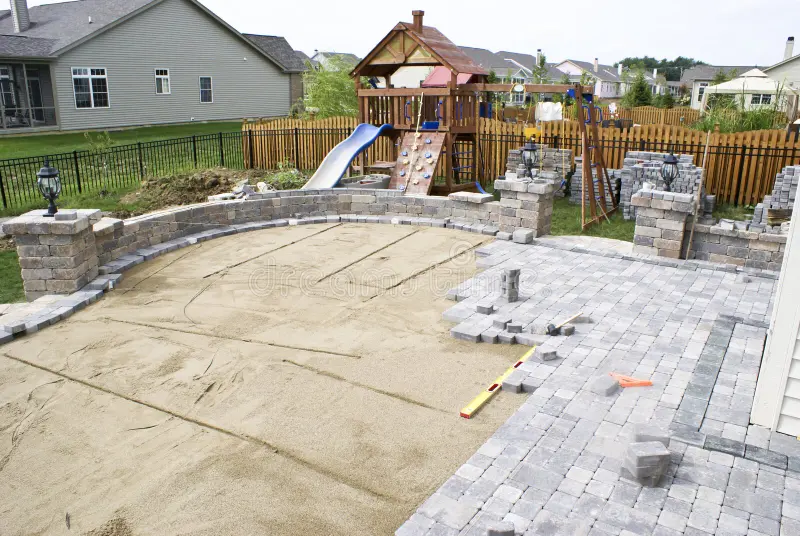 Concrete Contractor Installing Concrete to finish a custom patio