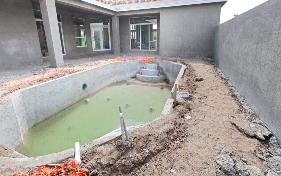 outdoor pool construction being built