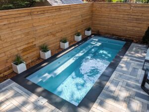 Modern Cocktail pool with wooden fence.